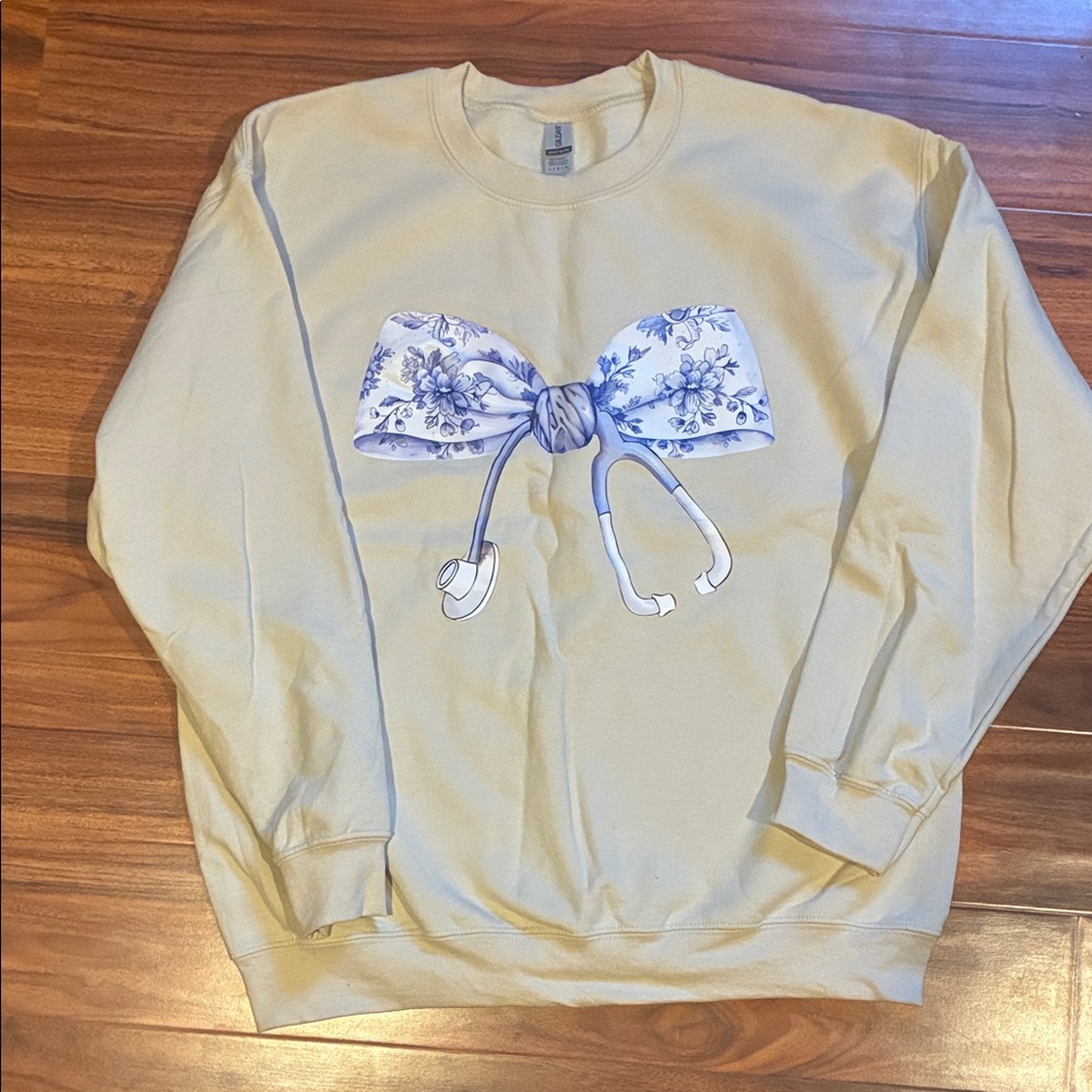 Gildan Cream Crewneck Sweater with Bow and Stethoscope design